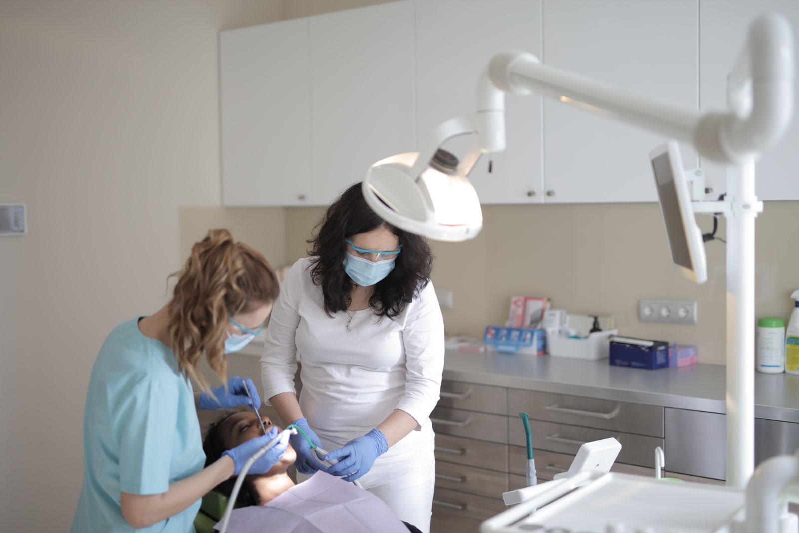 Clinicians treating a patient during a same-day emergency dental visit