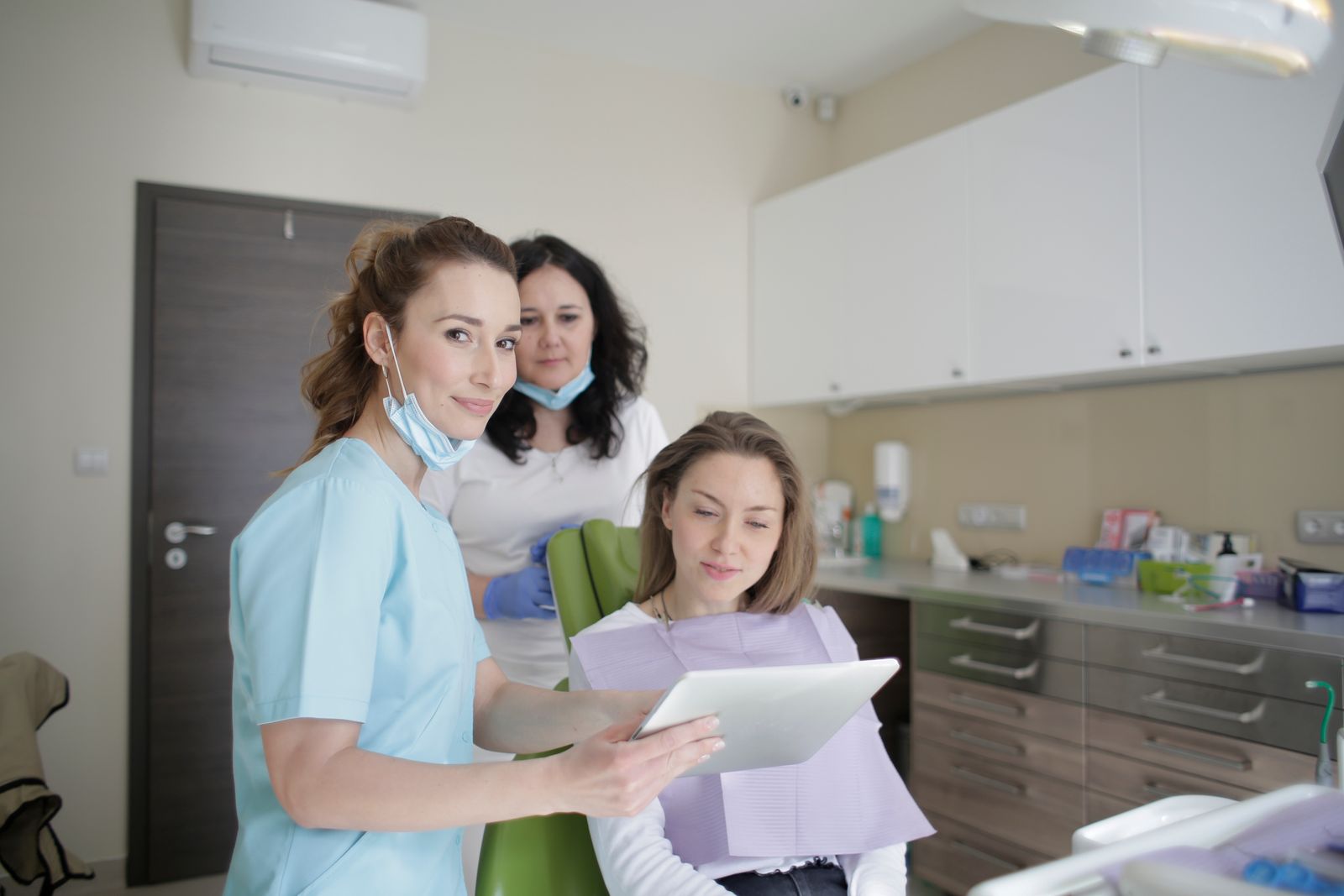 Clinicians reviewing insurance and financing options with a patient
